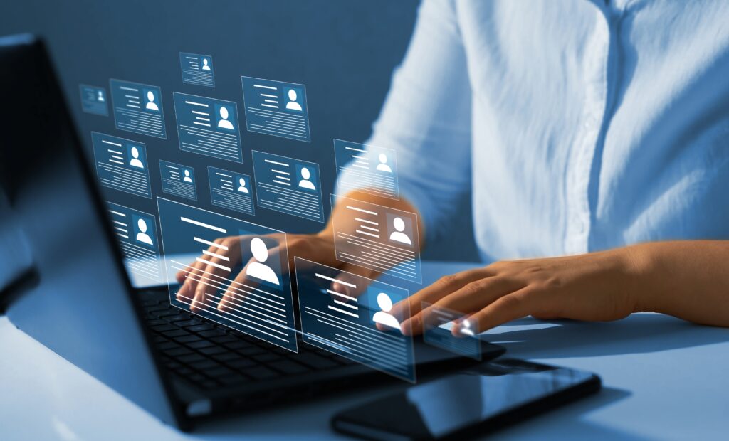 HR Recruitment image of person with laptop and people profiles