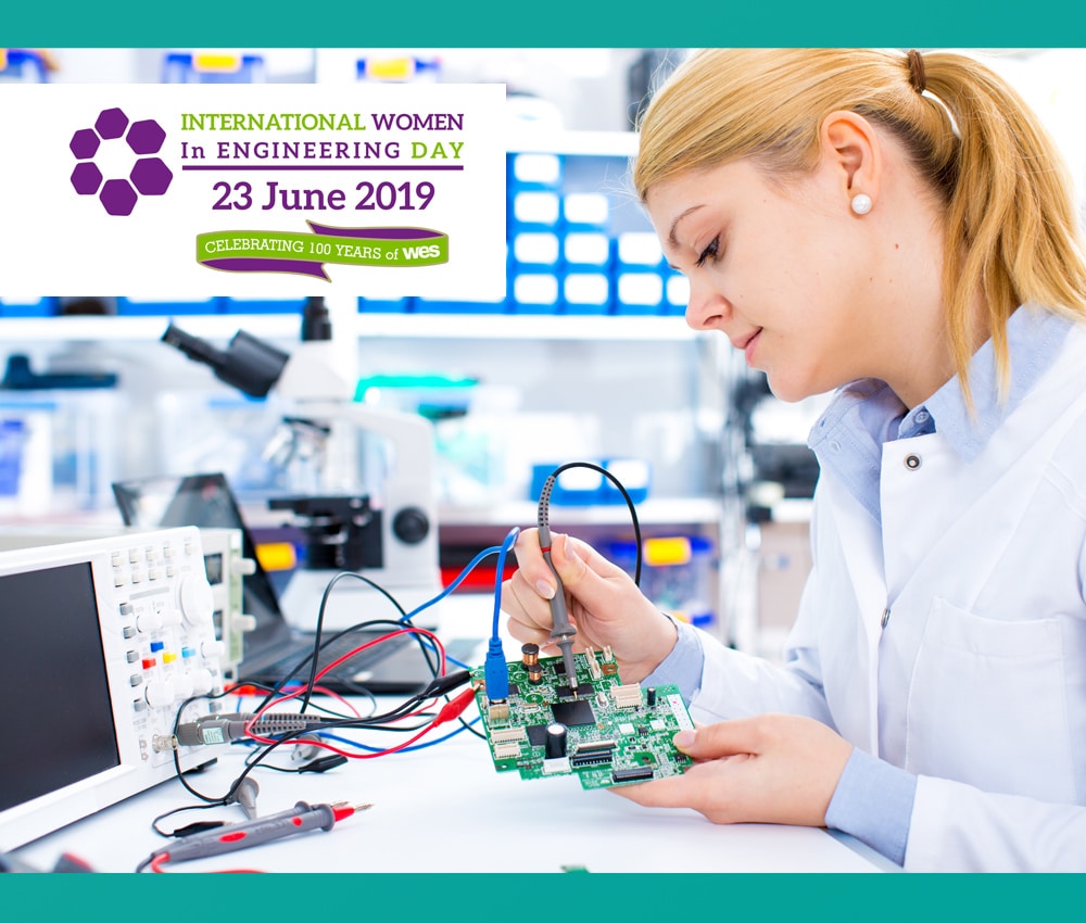 Image of a woman looking at a PCB Board for women in engineering
