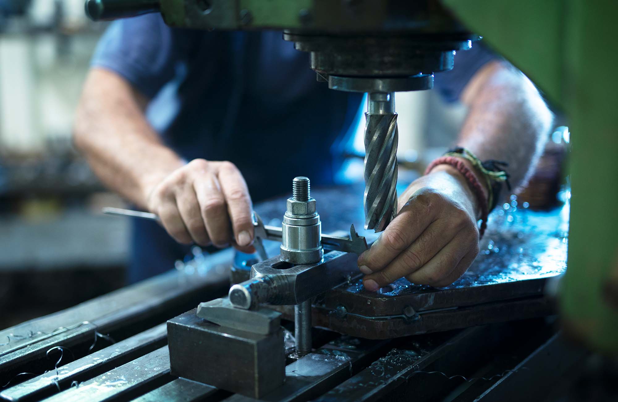 Image of a maintenance worker on a machine