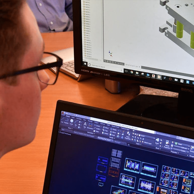 Clamason employee at computer