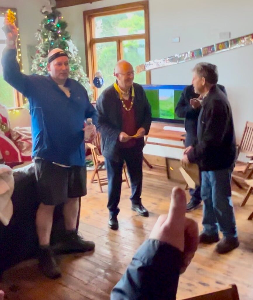 Peter Heap receives trophy for Wrekin 100 challenge 