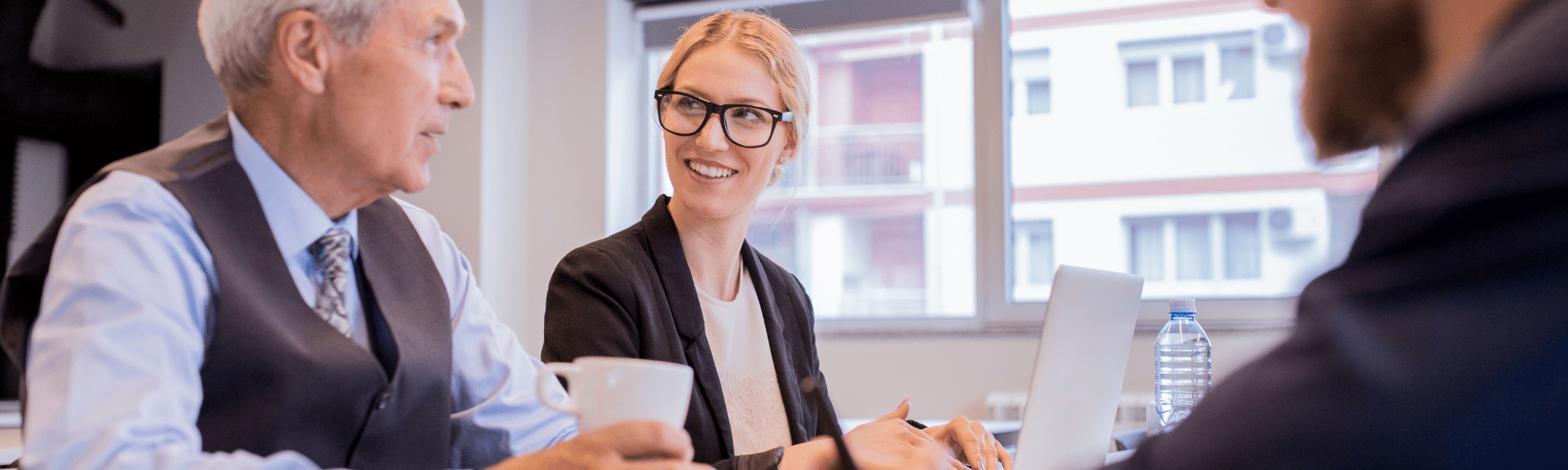 group of mixed professionals working and smiling