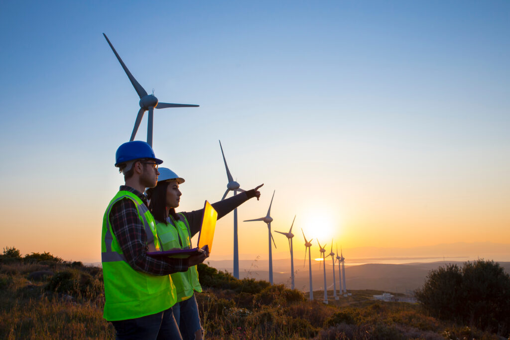 Energy professionals working at a wind turbine facility