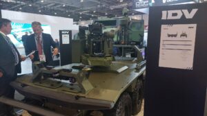 Tank at DSEI 2025 with people talking