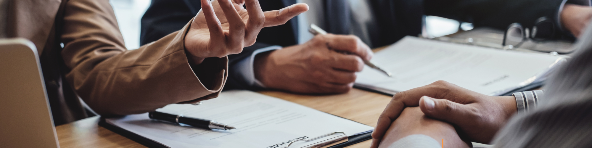 C-suite recruitment consultants reviewing leadership profiles