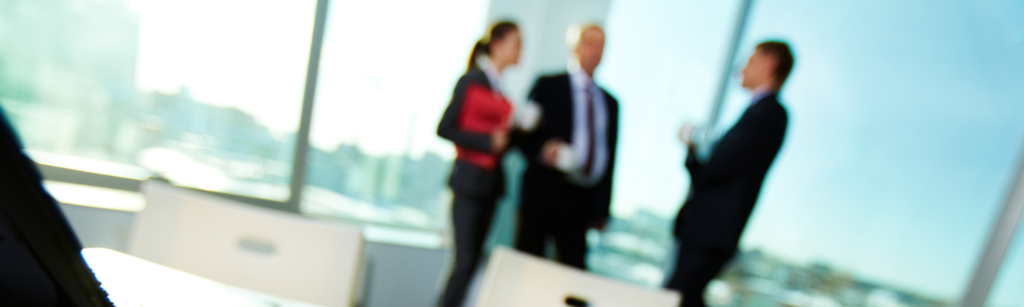 Executives in background out of focus shot