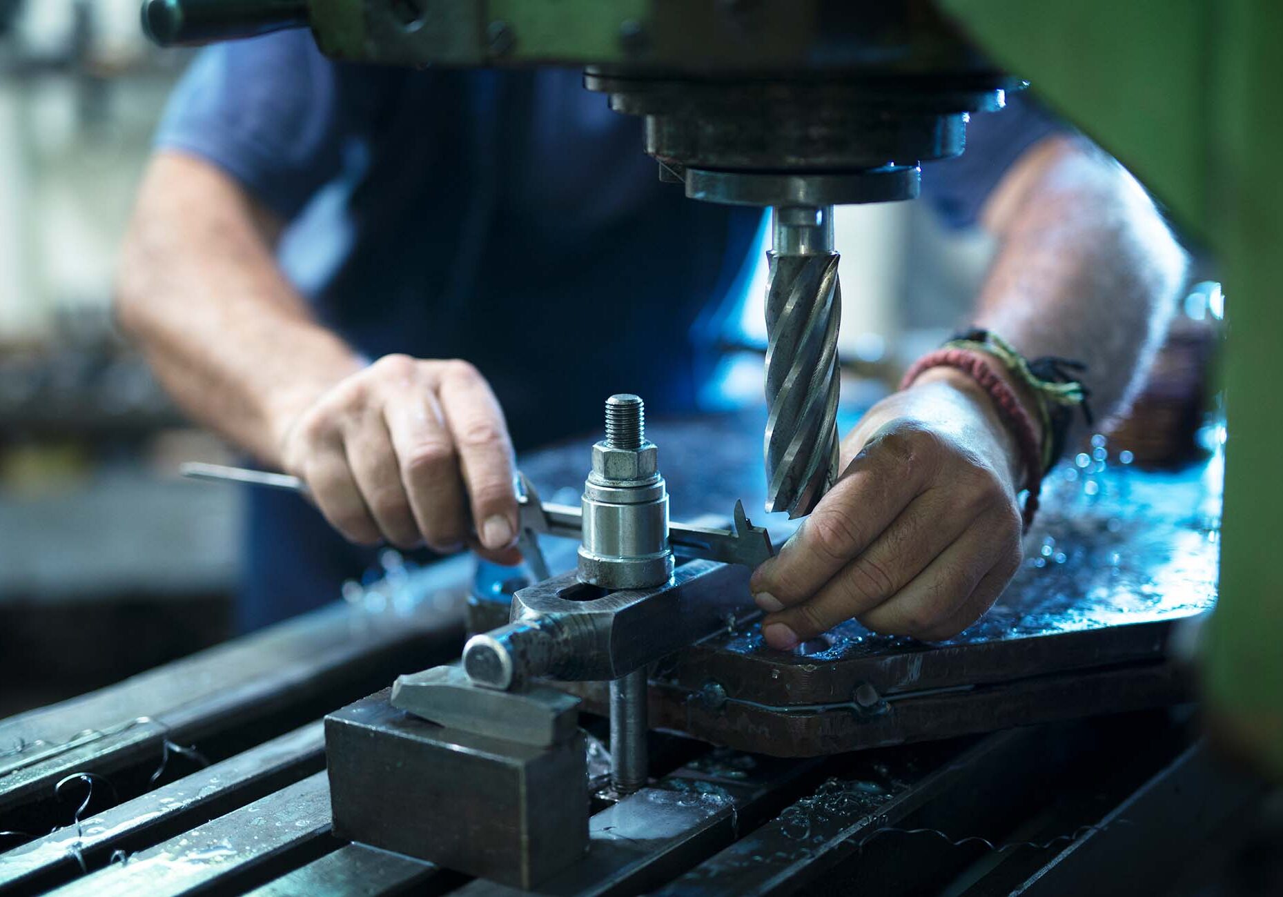 Image of maintenance worker working with metal